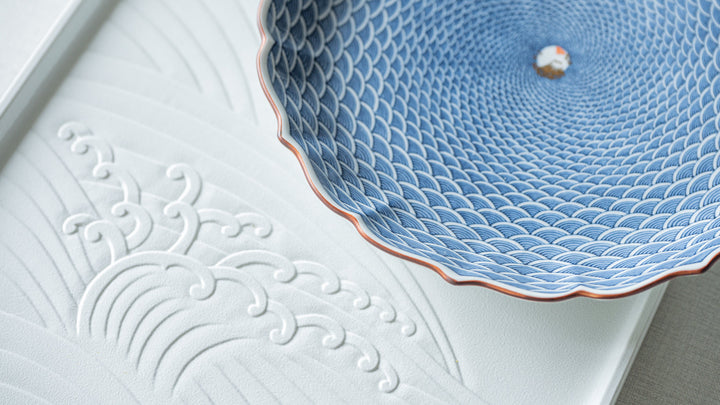 A Japanese plate featuring a traditional pattern inspired by water
