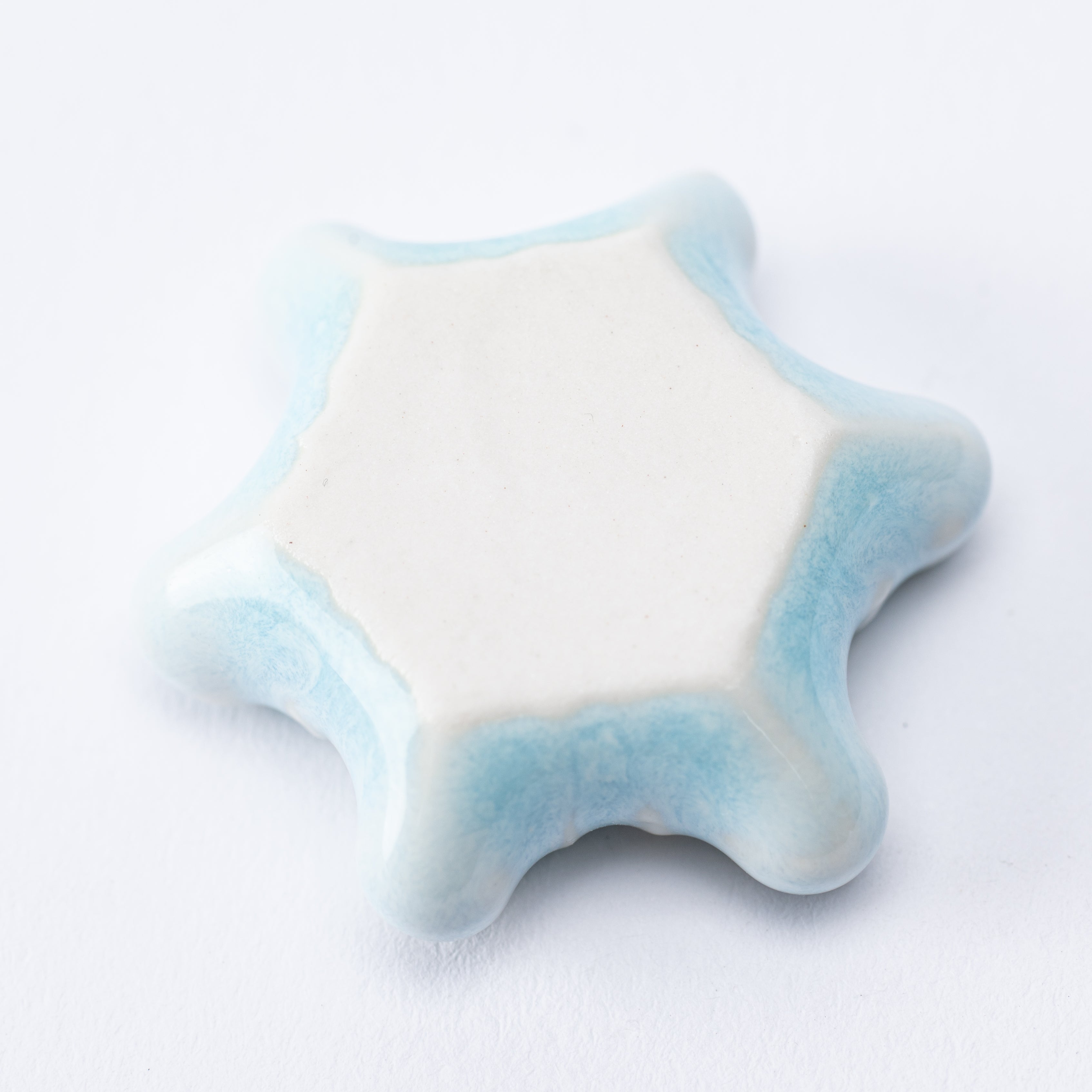 Reposapalillos con forma de copo de nieve en forma de estrella