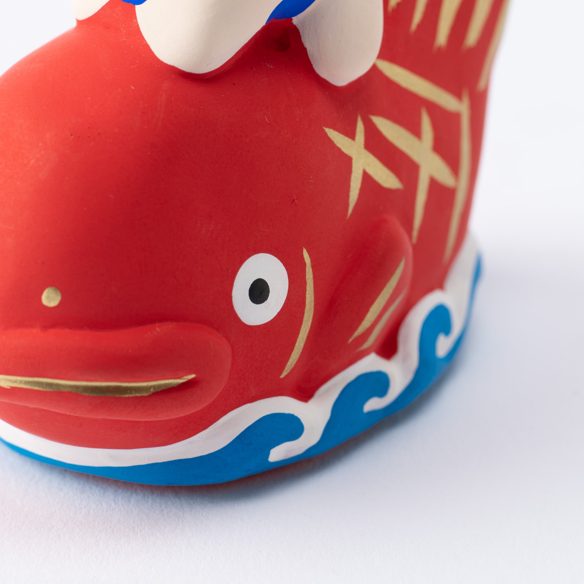 Figura de dorada y niño
