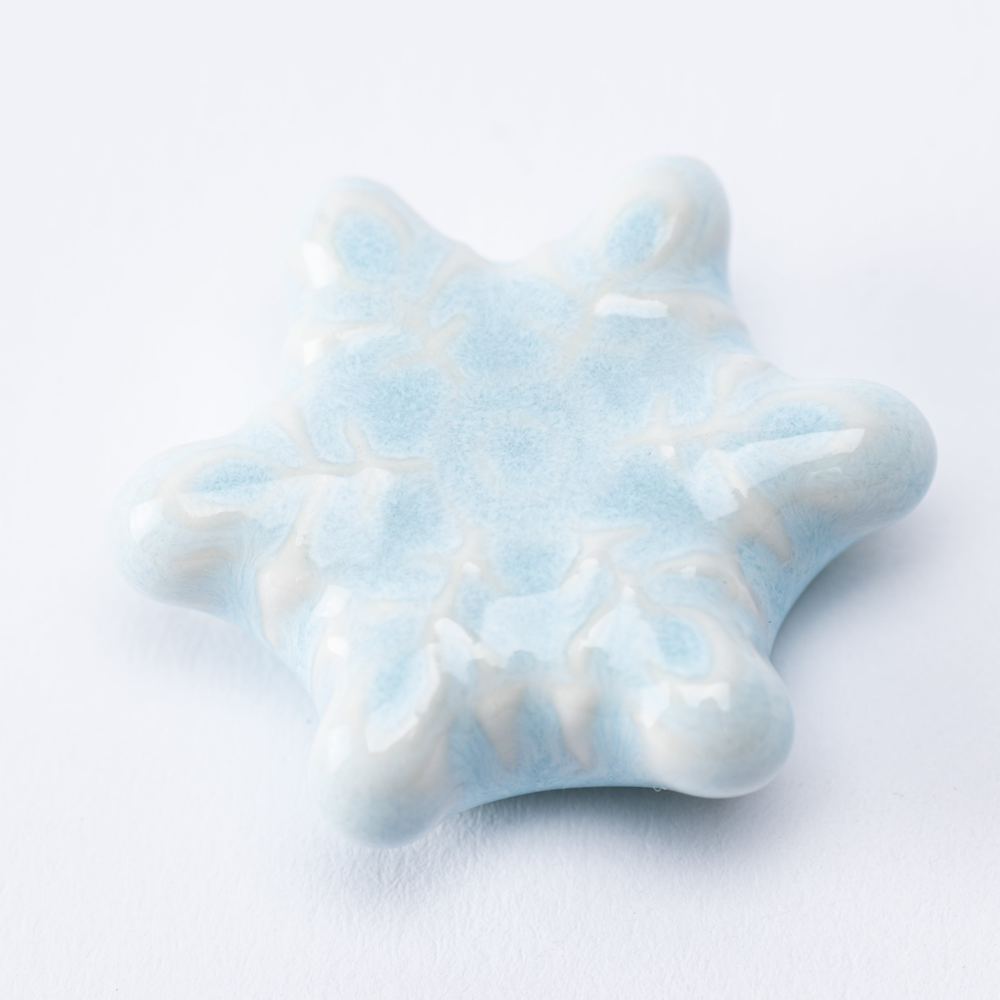 Reposapalillos con forma de copo de nieve en forma de estrella