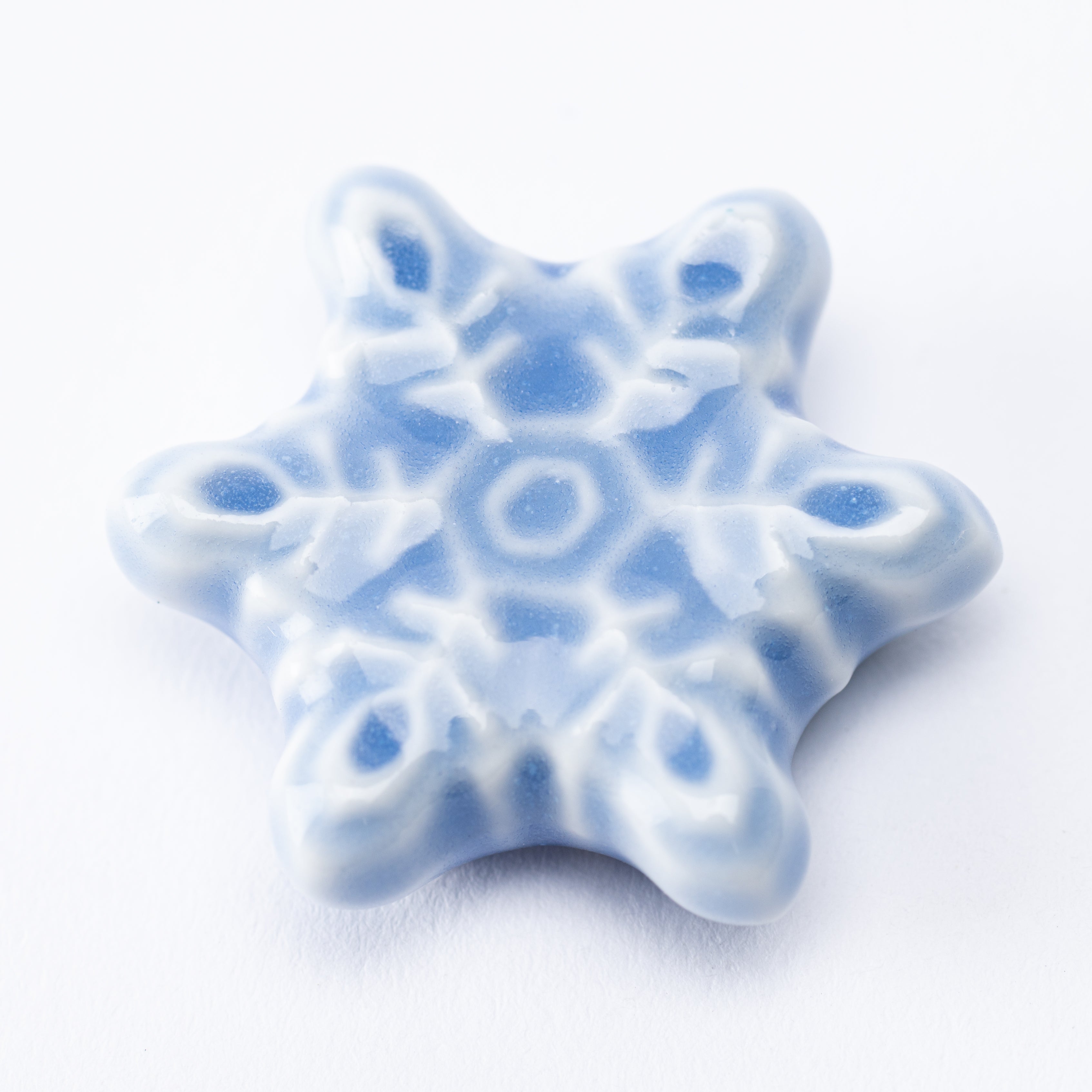 Reposapalillos con forma de copo de nieve en forma de estrella