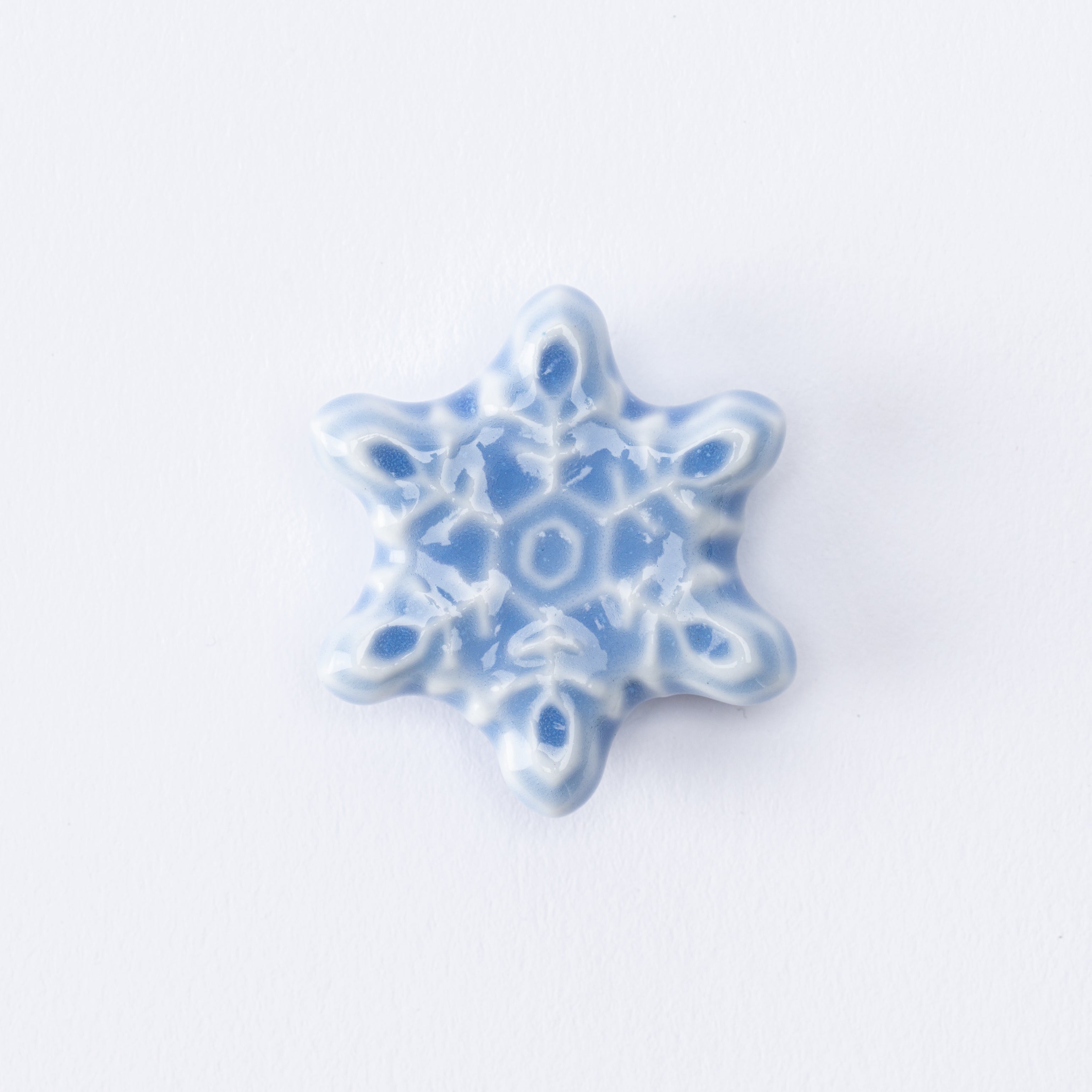 Reposapalillos con forma de copo de nieve en forma de estrella