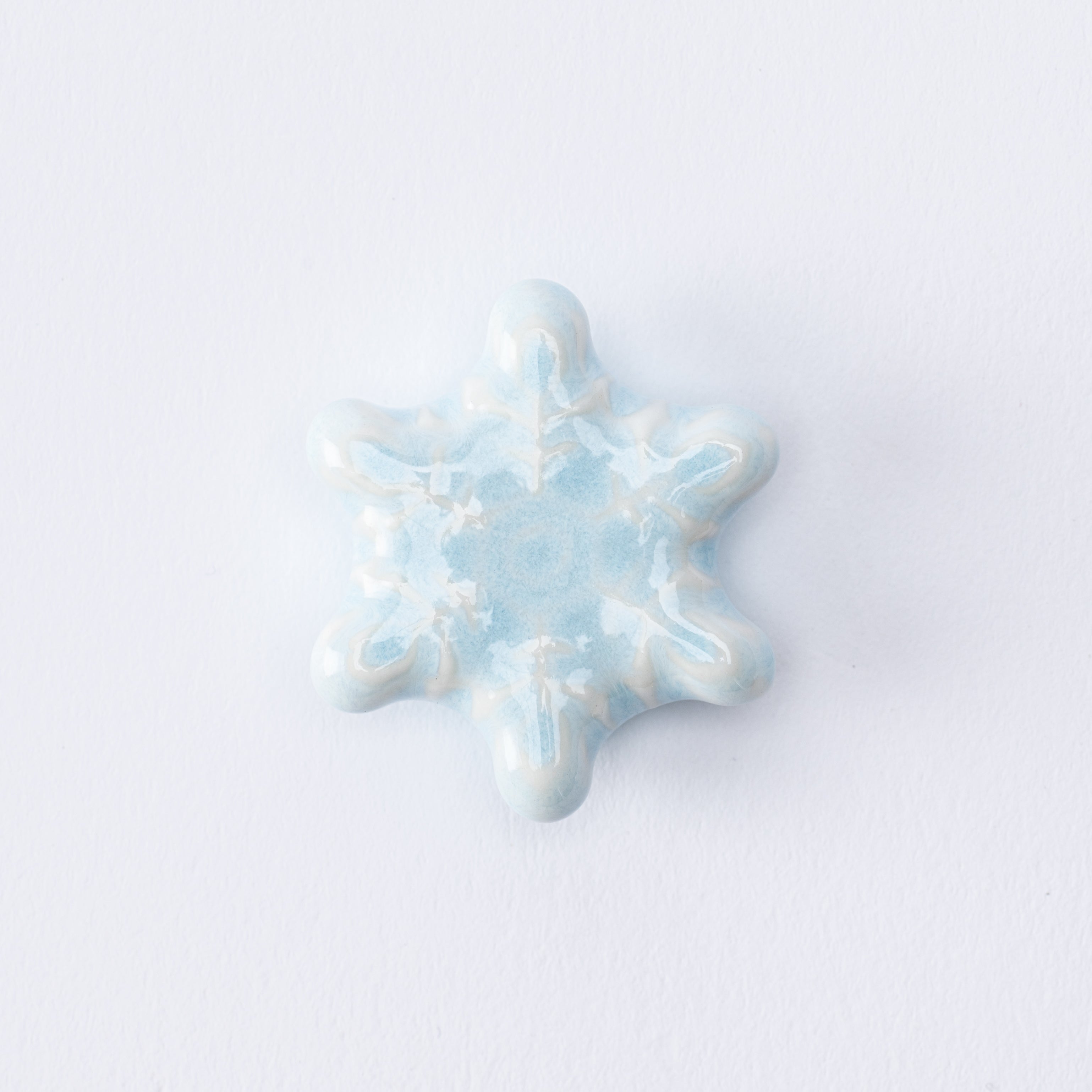 Reposapalillos con forma de copo de nieve en forma de estrella
