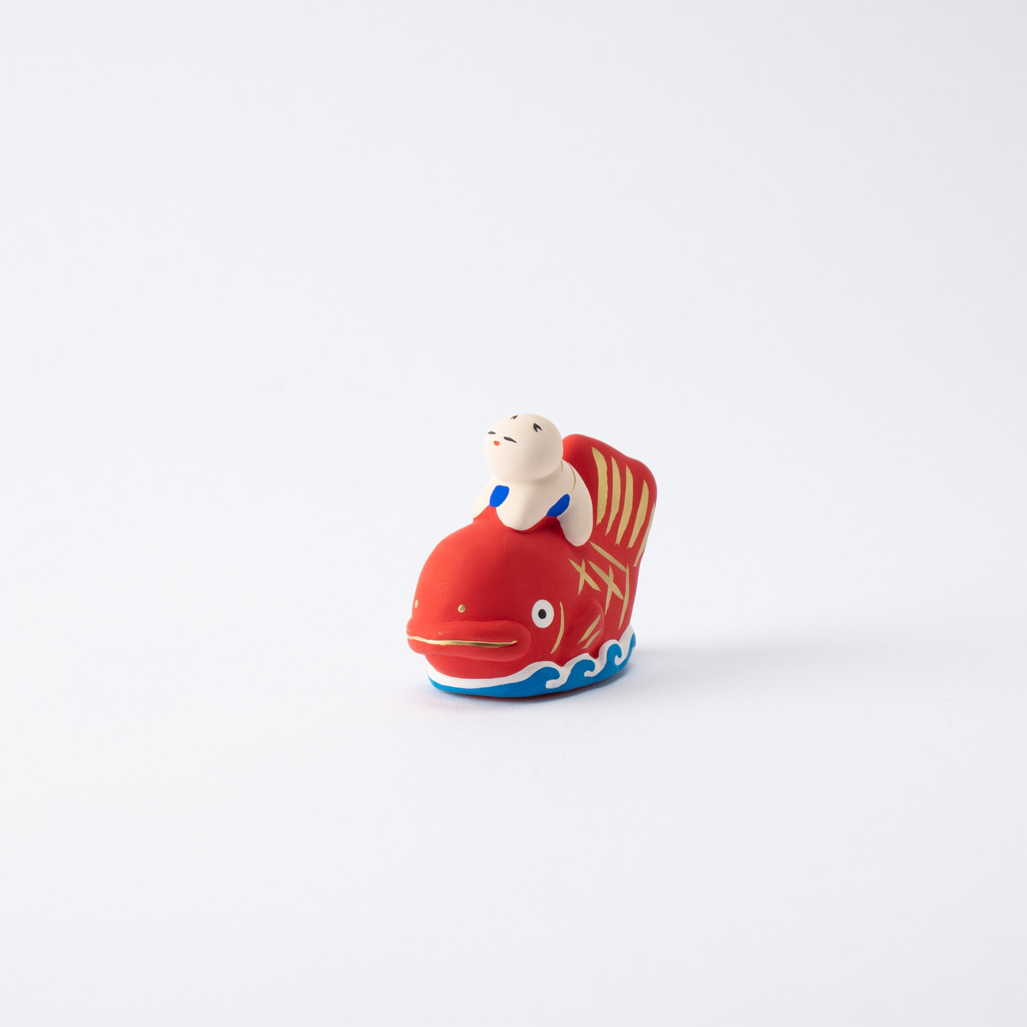Figura de dorada y niño