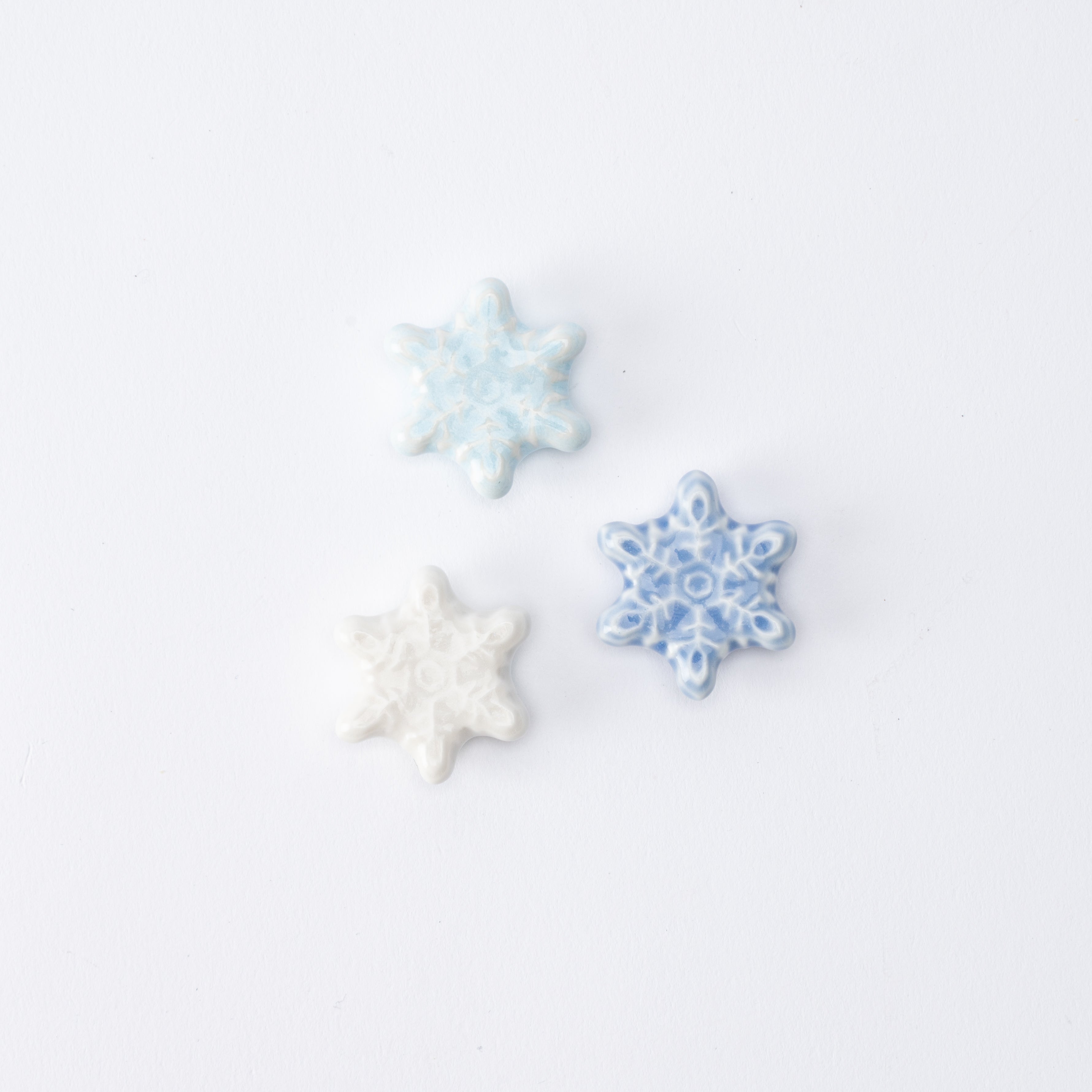 Reposapalillos con forma de copo de nieve en forma de estrella