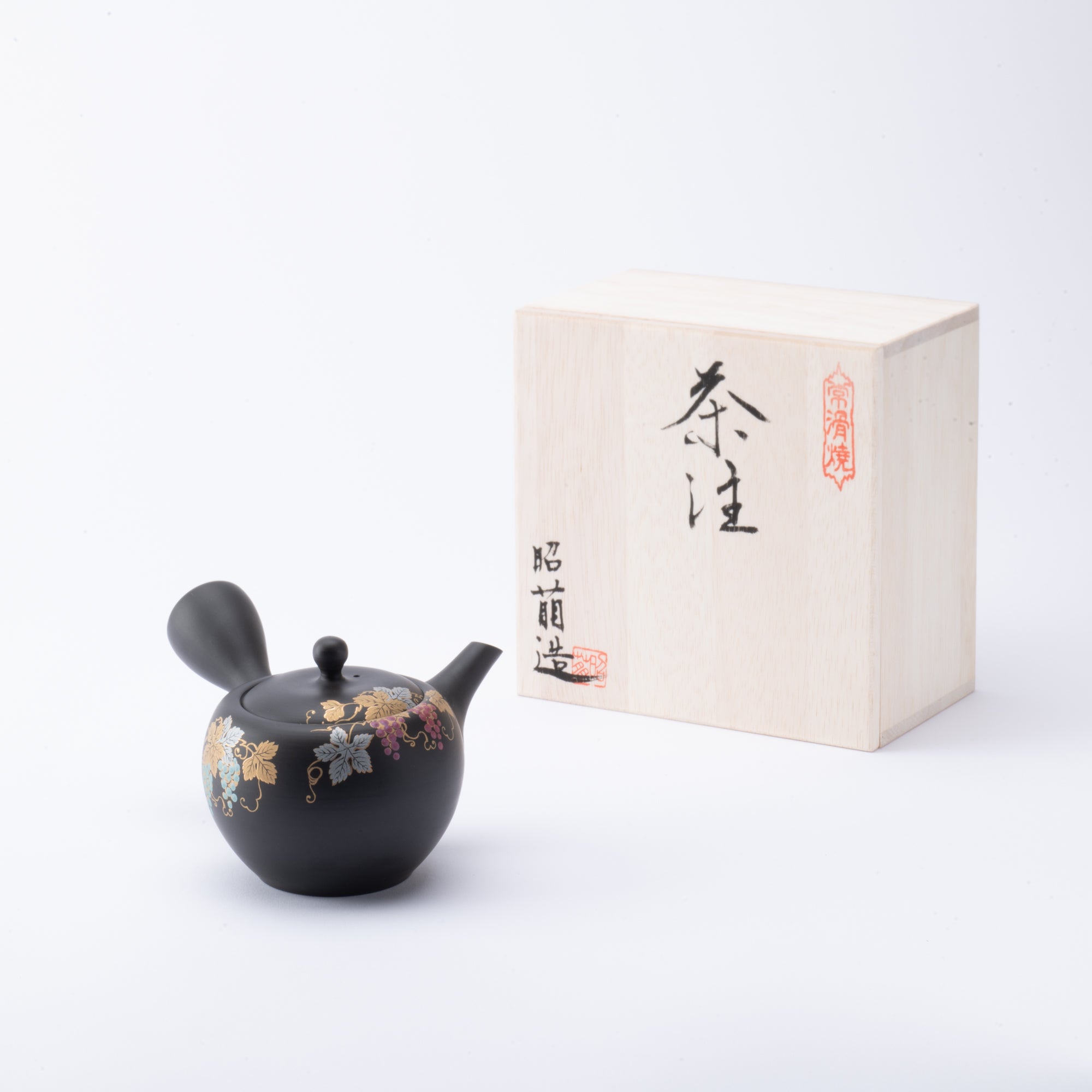 Tetera japonesa de arcilla negra con forma de uva