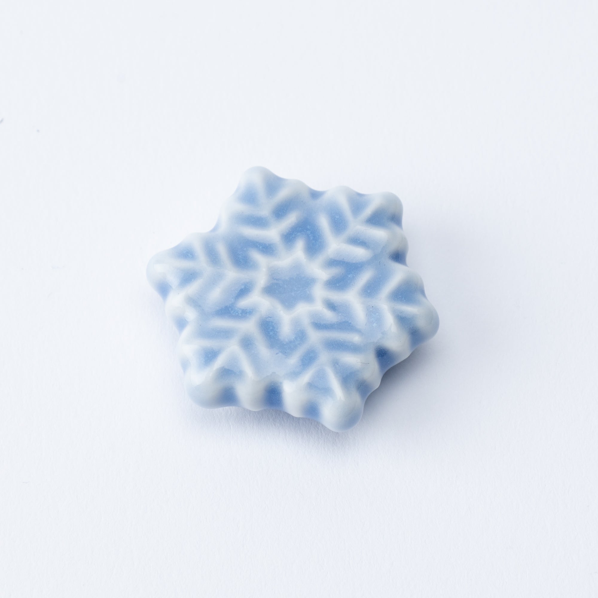 Reposapalillos hexagonal con forma de copo de nieve