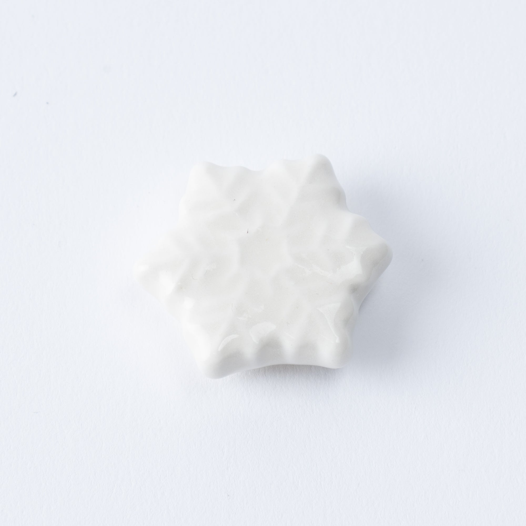 Reposapalillos hexagonal con forma de copo de nieve