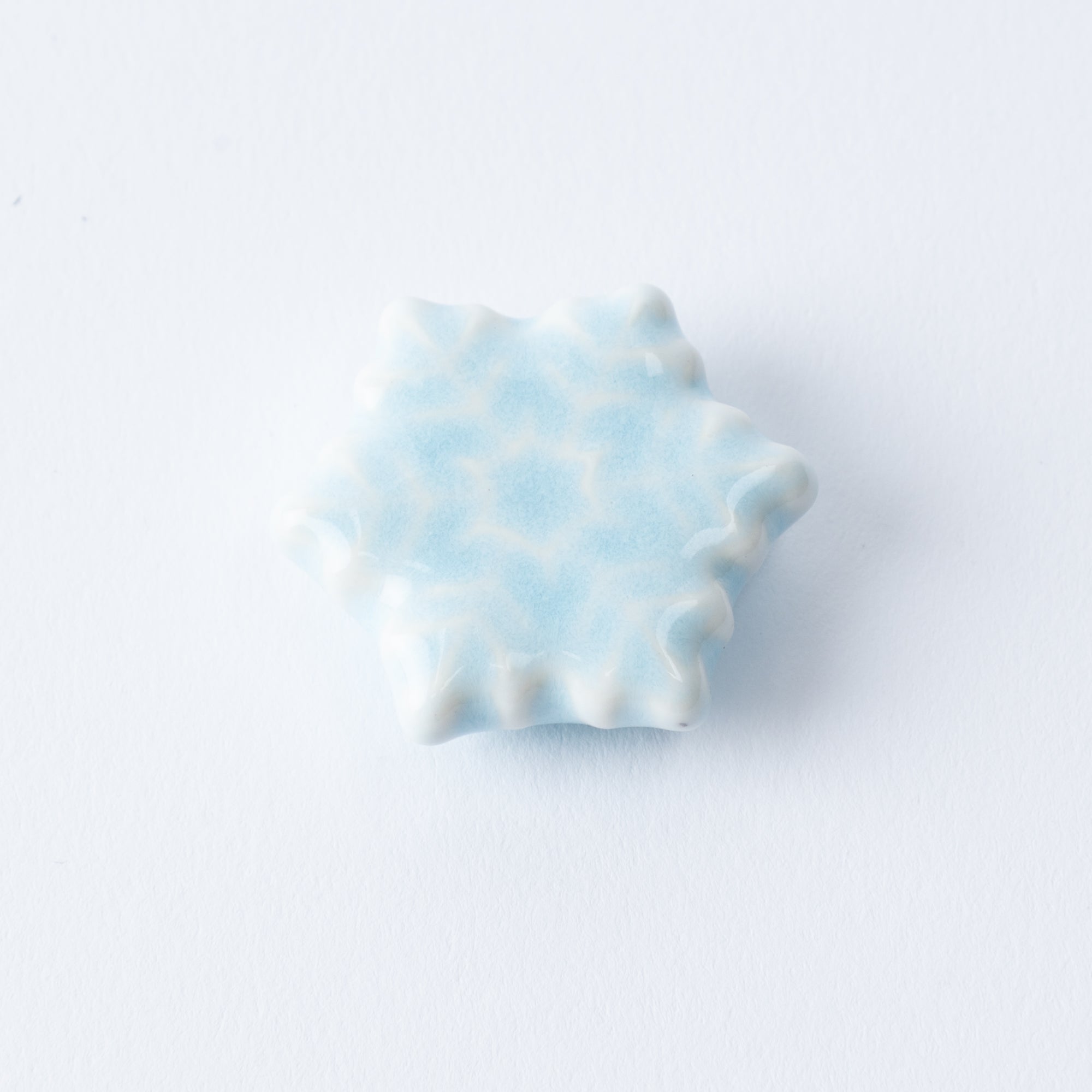 Reposapalillos hexagonal con forma de copo de nieve