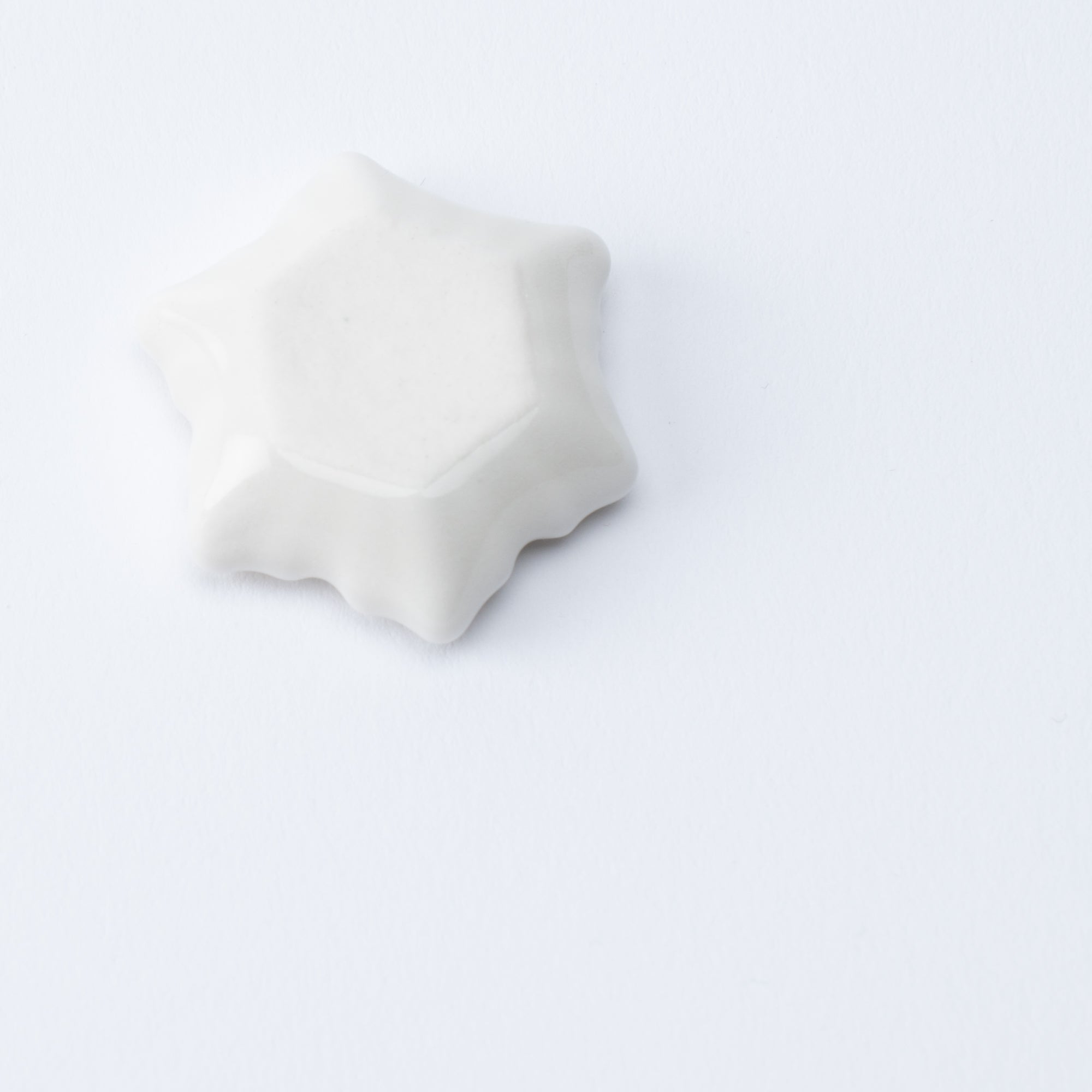 Reposapalillos hexagonal con forma de copo de nieve