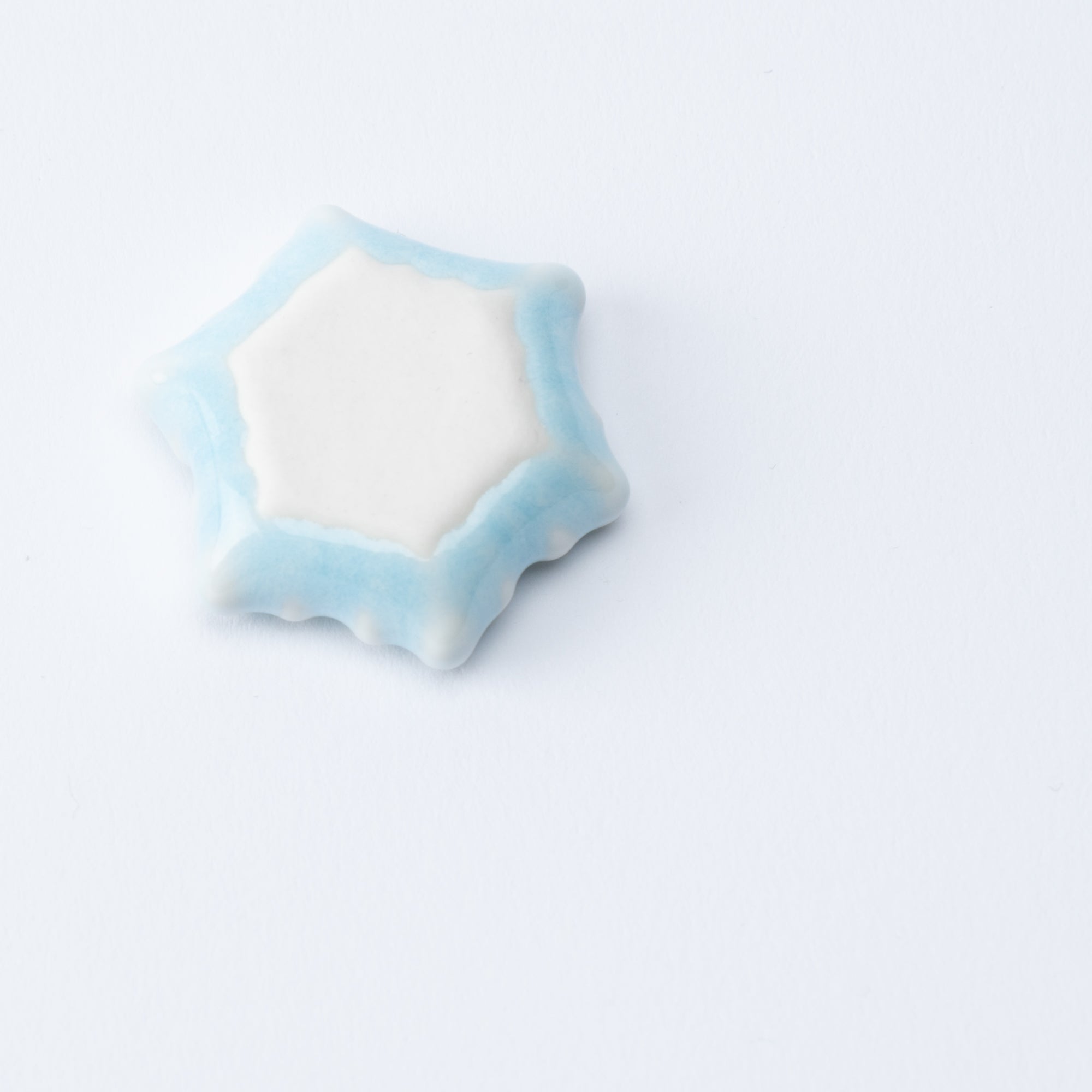 Reposapalillos hexagonal con forma de copo de nieve