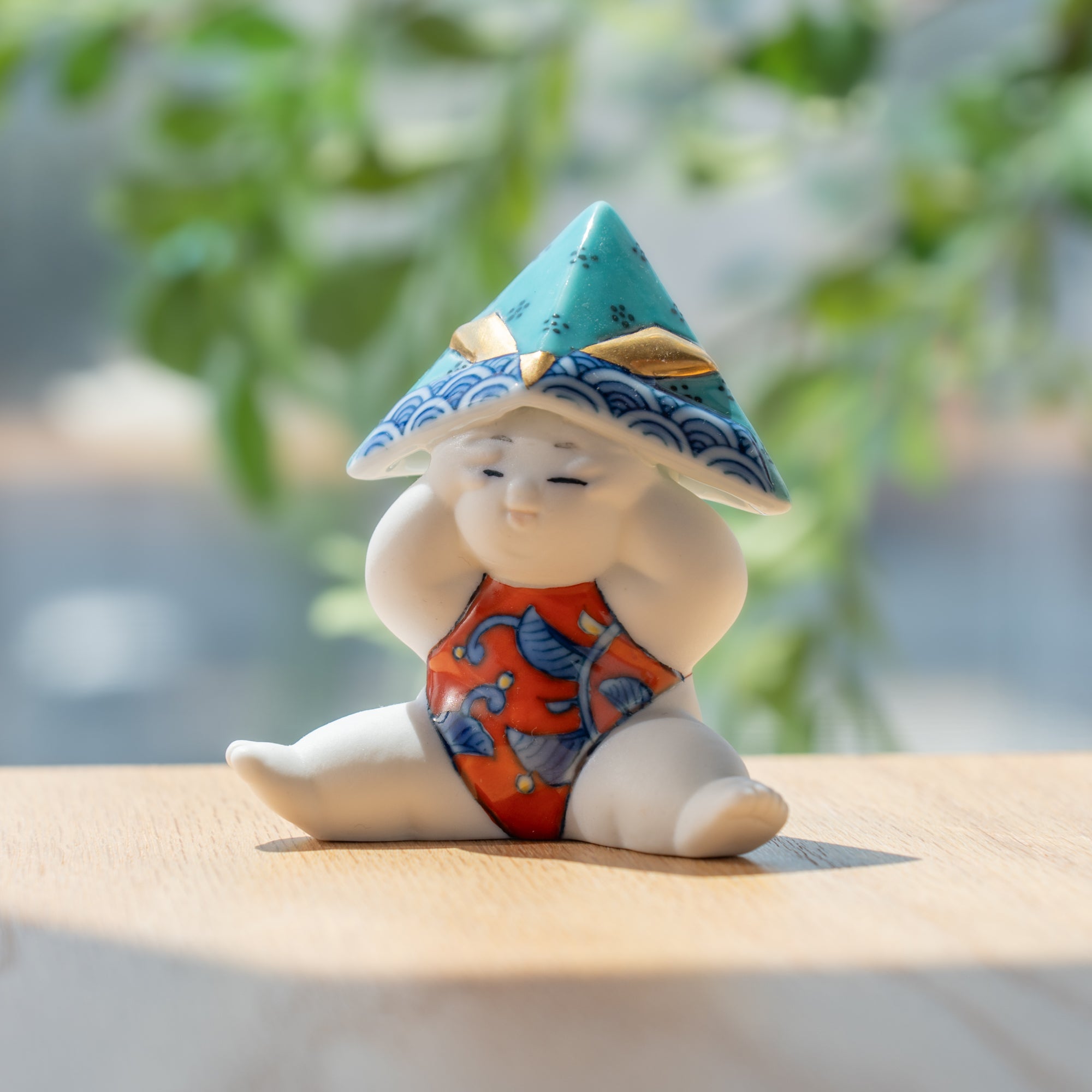 Kleine sitzende Gosho-Puppe für Jungenfestival