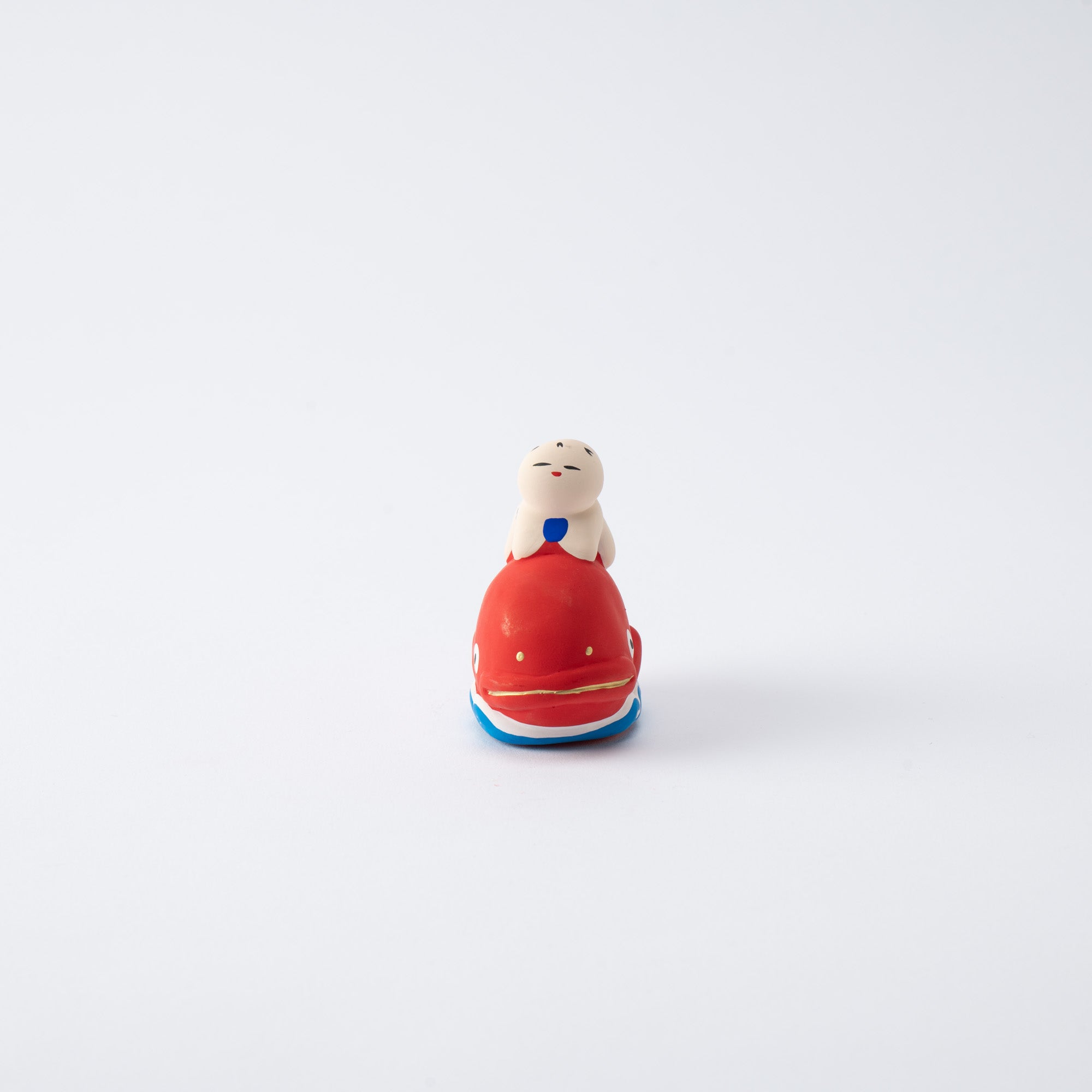 Figura de dorada y niño
