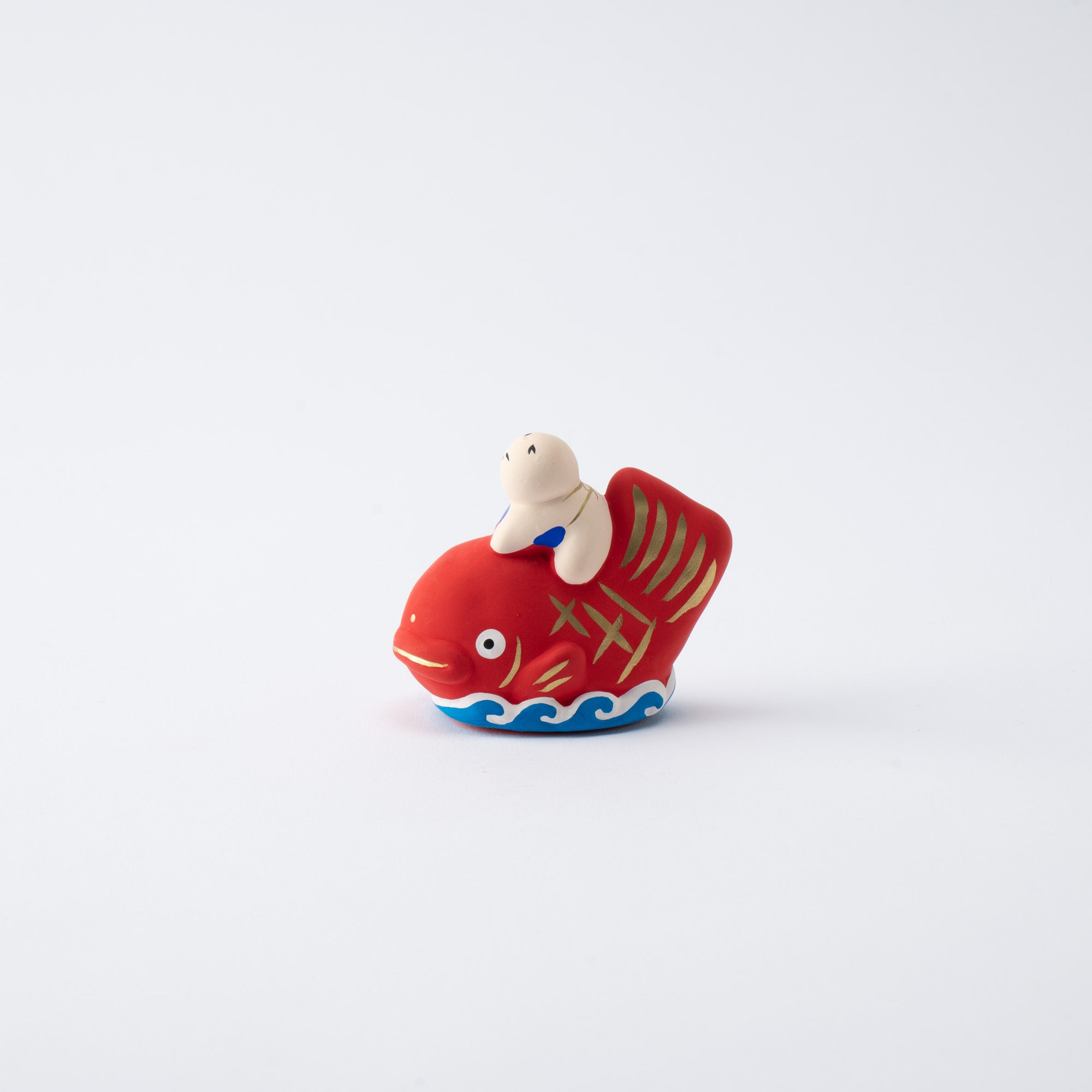Figura de dorada y niño