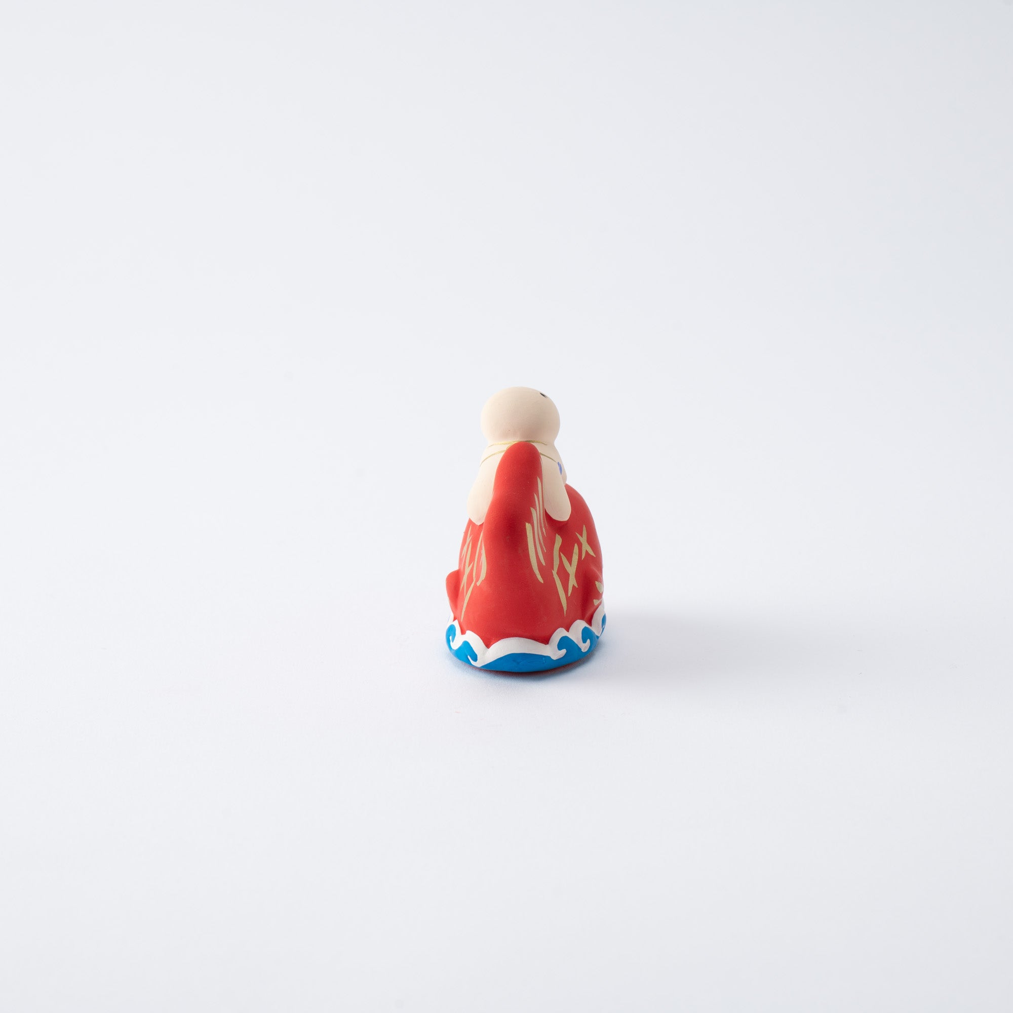 Figura de dorada y niño