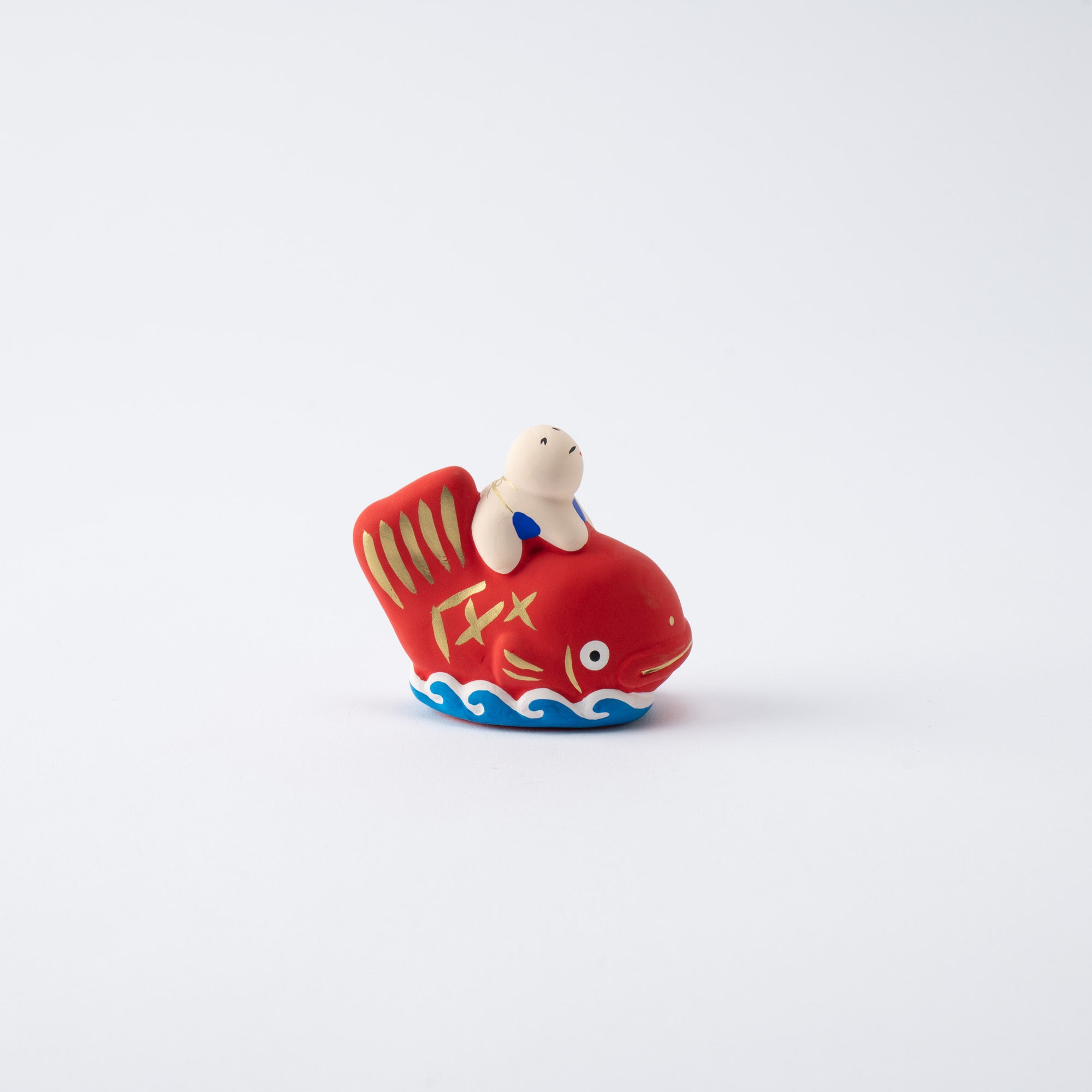 Figura de dorada y niño