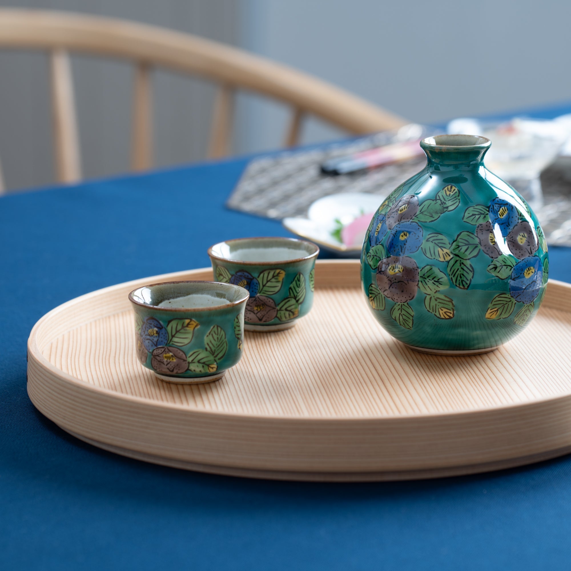 Blue ceramics with pink sakura design made in Japan available at Miya.