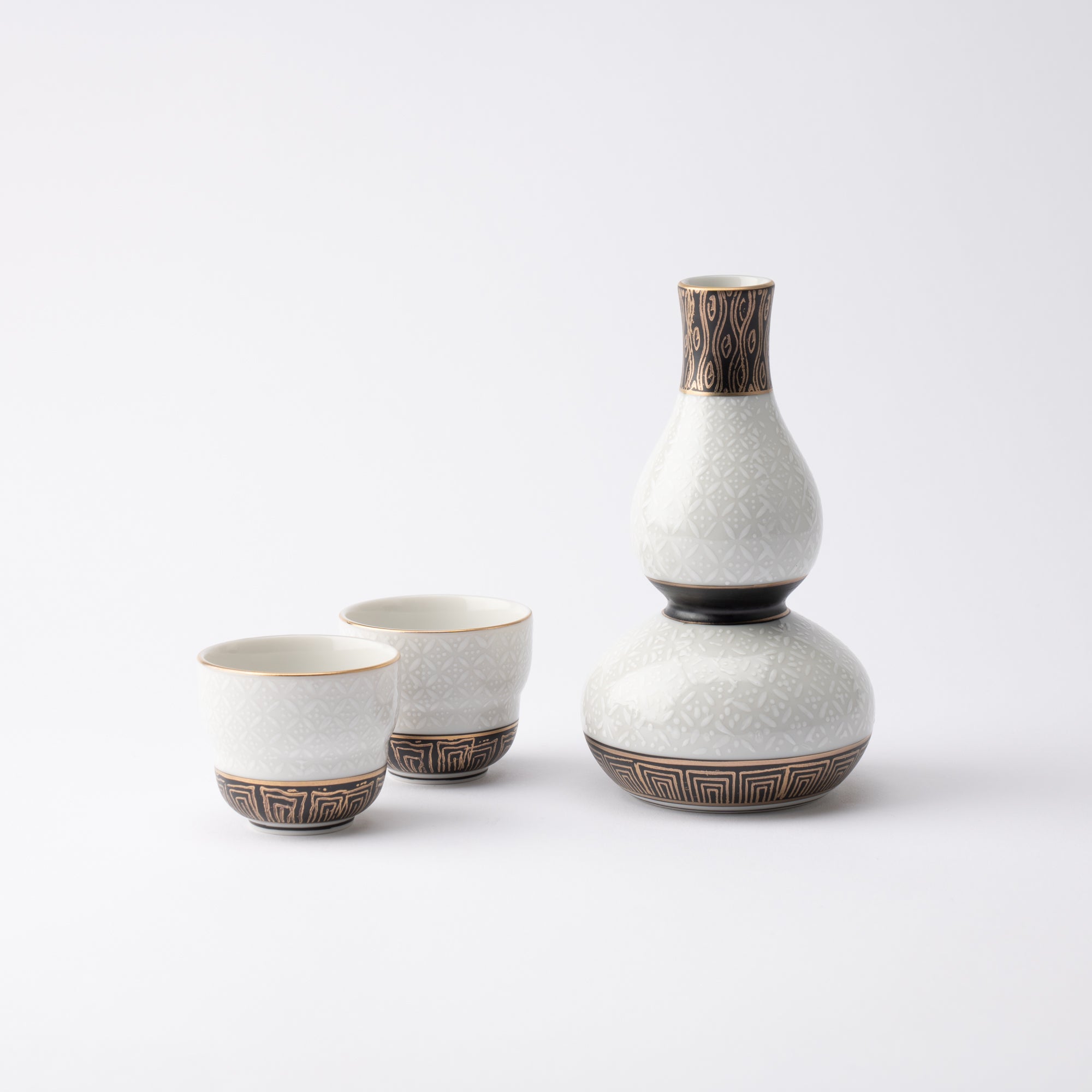 http://musubikiln.com/cdn/shop/products/white-cloisonne-kutani-sake-set-musubi-kiln-handmade-japanese-tableware-and-japanese-dinnerware-356051.jpg?v=1653988749