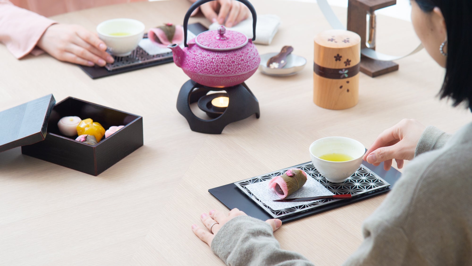 Hot Tea at the Table with Colorful Nambu Ironware Cast Iron Teapots