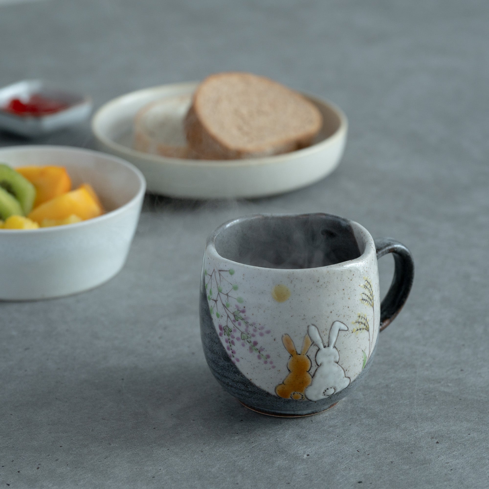 Rabbits In Sunny Spot Mug