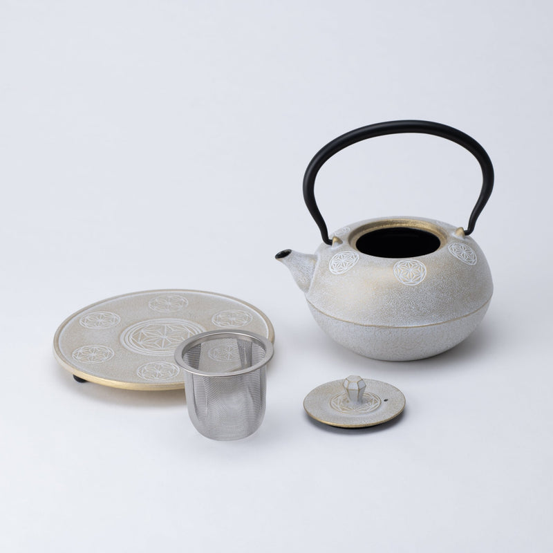 https://musubikiln.com/cdn/shop/products/seven-stars-nambu-ironware-cast-iron-teapot-with-trivet-musubi-kiln-handmade-japanese-tableware-and-japanese-dinnerware-524569_800x.jpg?v=1703557824