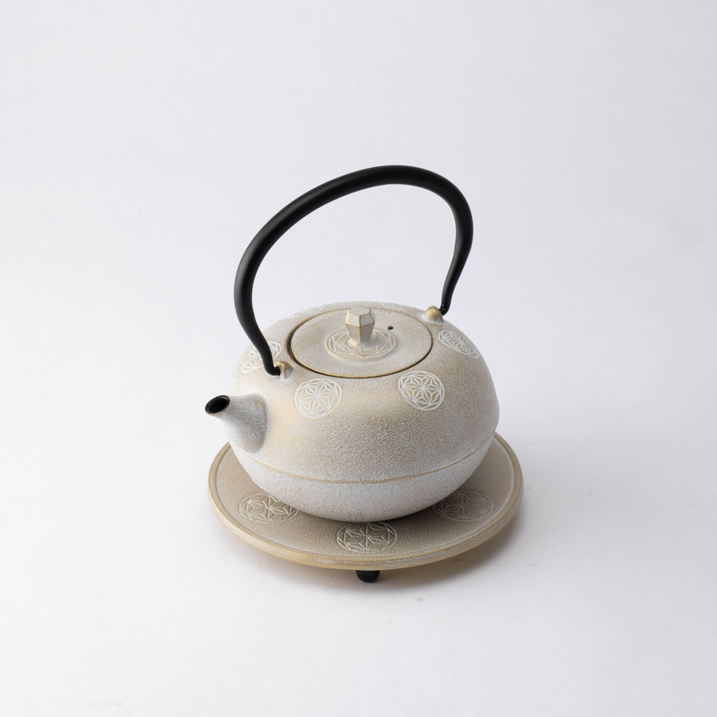 https://musubikiln.com/cdn/shop/products/seven-stars-nambu-ironware-cast-iron-teapot-with-trivet-musubi-kiln-handmade-japanese-tableware-and-japanese-dinnerware-605947_1024x.jpg?v=1642774914