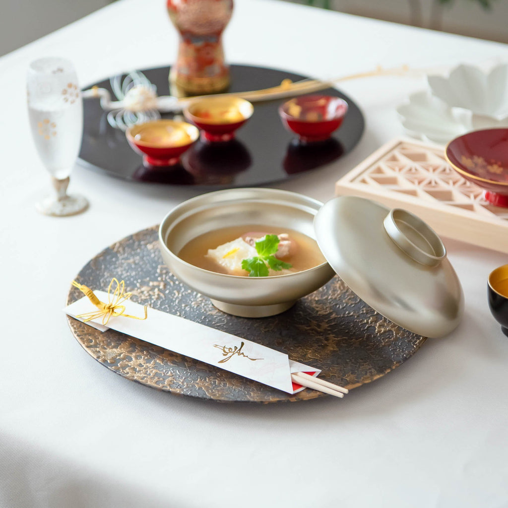 https://musubikiln.com/cdn/shop/products/silver-yamanaka-lacquer-soup-bowl-with-lid-musubi-kiln-handmade-japanese-tableware-and-japanese-dinnerware-310288_1024x.jpg?v=1643354598